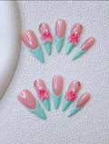 Turquoise French-tip Stiletto nails with 3D Hibiscus