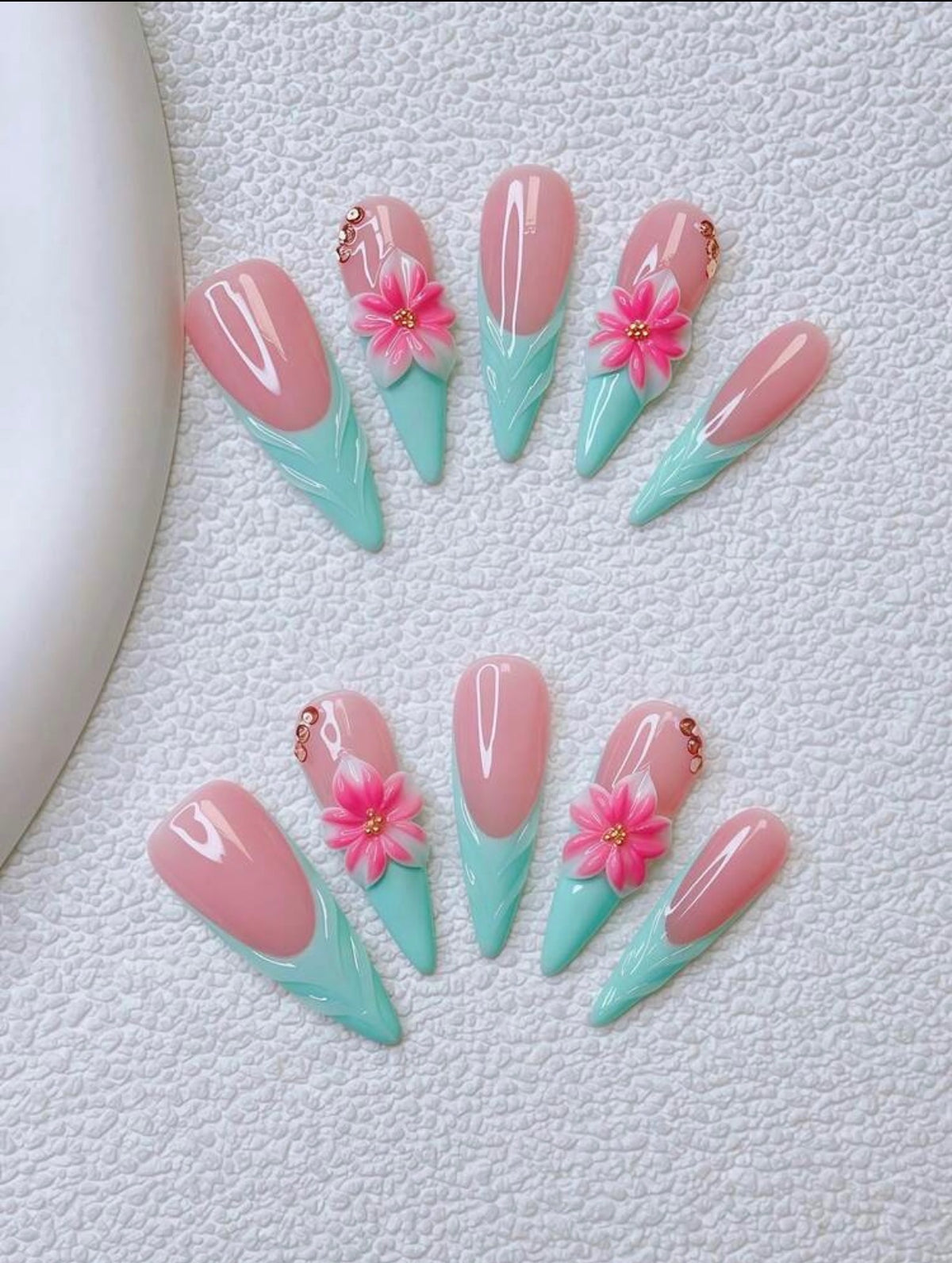 Turquoise French-tip Stiletto nails with 3D Hibiscus